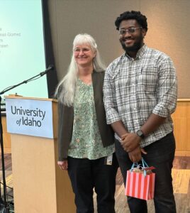 Dr. Shirley Luckhart with a young researcher at University of Idaho event.