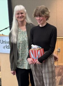 Dr. Shirley Luckhart with a young recipient at an award ceremony.